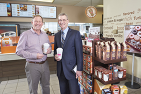 Chris Swanson, Ashland Dunkin' Donuts franchise owner with John Swedberg, SVP, Commercial Loan Officer, Meredith Village Savings Bank.
