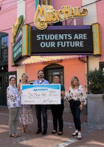 Caption: Jim Carrigan, Assistant Vice President, Portsmouth Branch and Business Development Manager, center, presents a sponsorship check for The Music Hall’s 2021-2022 School Days Series Season.